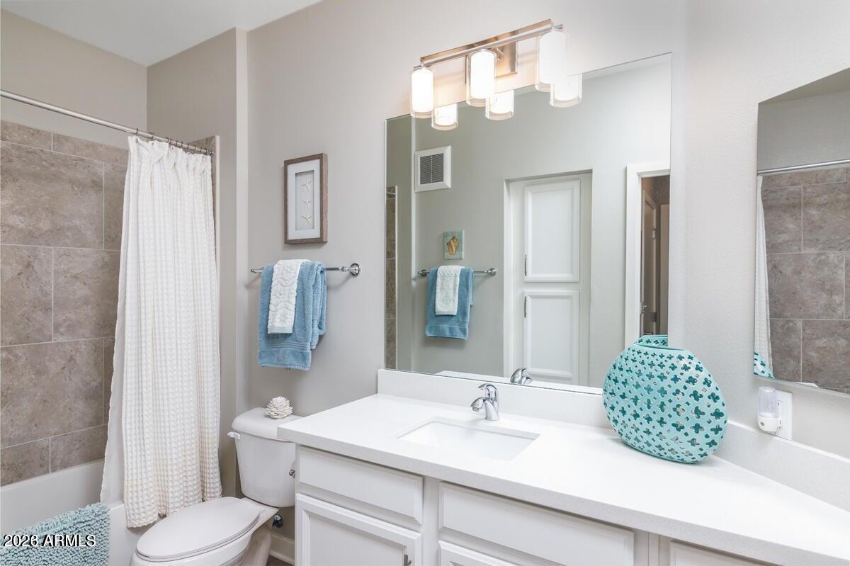 2511 West Queen Creek Road, Unit 260 Chandler, AZ 85248 - Photo 12 of 24 a bathroom with a sink toilet and shower