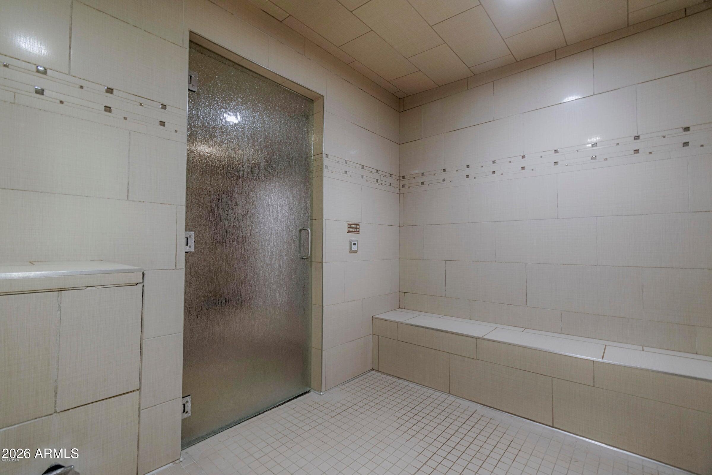 2511 West Queen Creek Road, Unit 260 Chandler, AZ 85248 - Photo 19 of 24 a bathroom with a bathtub and shower