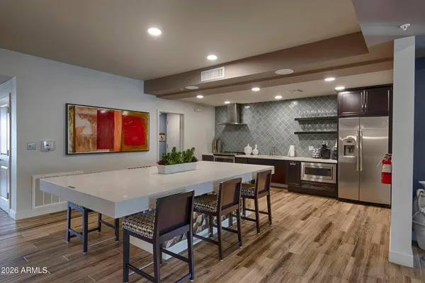 a kitchen with a table and chairs in it