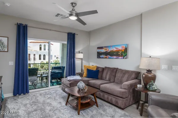a living room with furniture and a large window