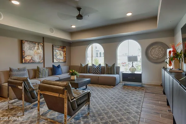 a living room with furniture and a large window