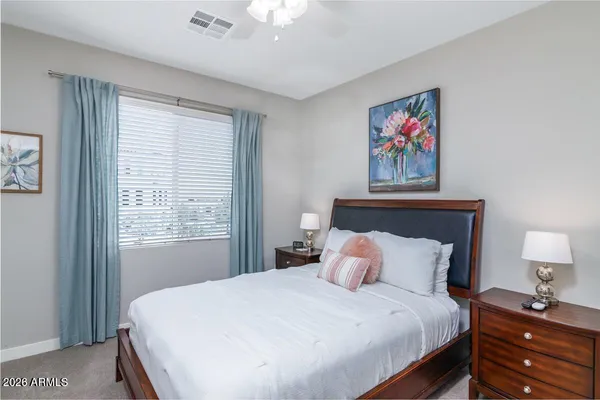 a bedroom with a bed and a window