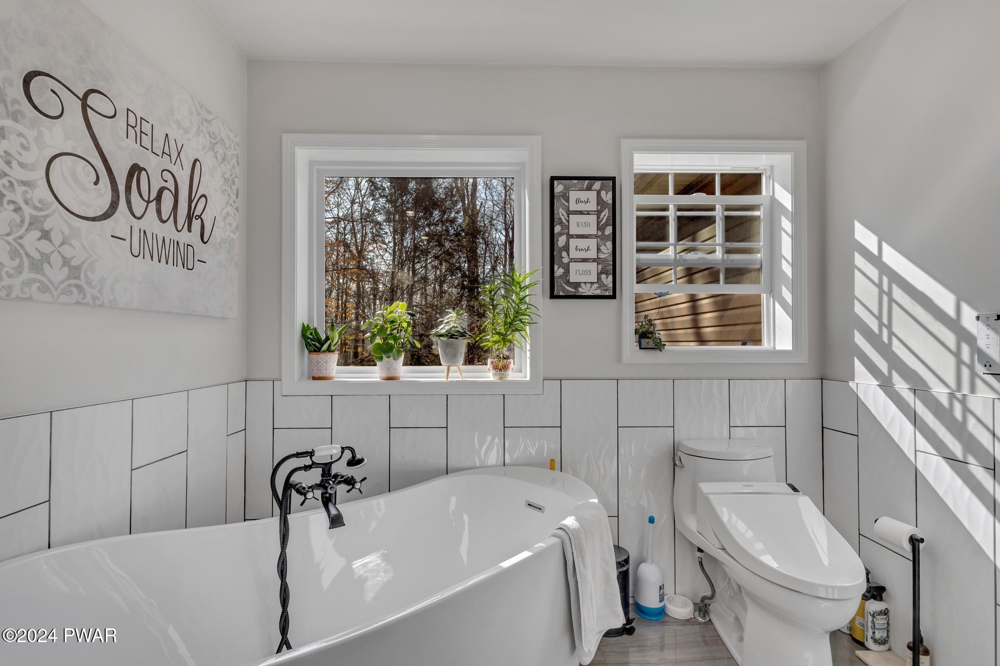 2596 Boulder Road Lake Ariel, PA 18436 - Photo 23 of 57 a bathroom with a sink a toilet and bathtub