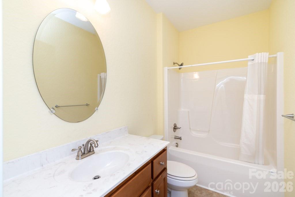 12 Chigger Ridge Road Sylva, NC 28779 - Photo 19 of 28 a bathroom with a sink a toilet and a mirror