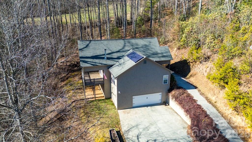 12 Chigger Ridge Road Sylva, NC 28779 - Photo 2 of 28 a backyard of a house with a yard and outdoor seating