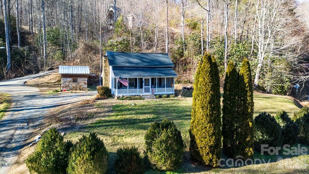 12 Chigger Ridge Road Sylva, NC 28779 - Photo 26 of 28 a swimming pool with outdoor seating and yard