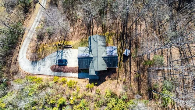 a kitchen with stainless steel appliances granite countertop a refrigerator a oven and a sink with granite countertops