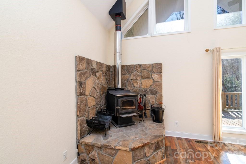 12 Chigger Ridge Road Sylva, NC 28779 - Photo 10 of 28 a living room with furniture and a fireplace