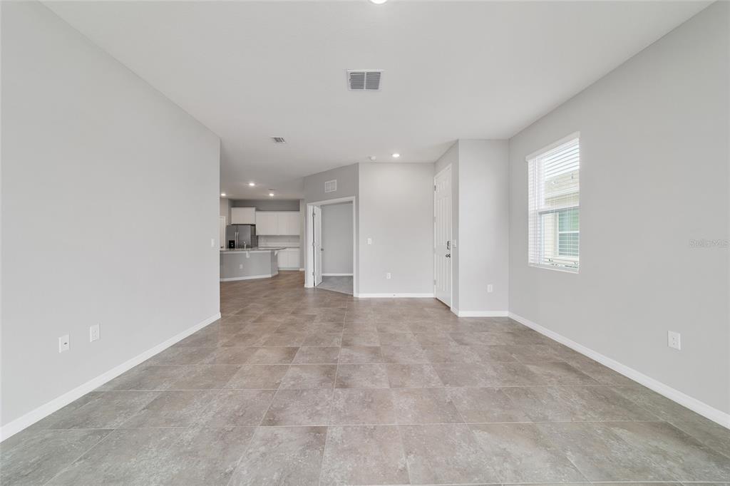 5339 Northwest 46th Ln Road Ocala, FL 34482 - Photo 11 of 79 a view of a big room with windows and cabinet