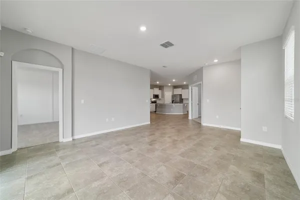 a kitchen with stainless steel appliances a refrigerator a sink a stove a microwave and cabinets