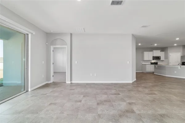 a kitchen with a sink stainless steel appliances and white cabinets