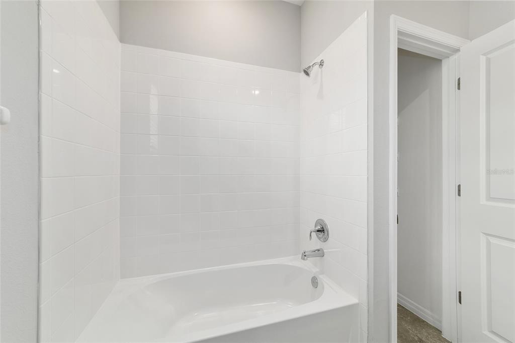 5339 Northwest 46th Ln Road Ocala, FL 34482 - Photo 35 of 79 a white bath tub sitting next to a white sink