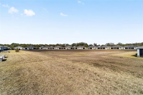 an aerial view of a houses with outdoor space