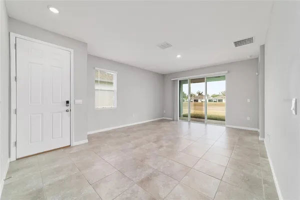 a view of a big room with windows and cabinet