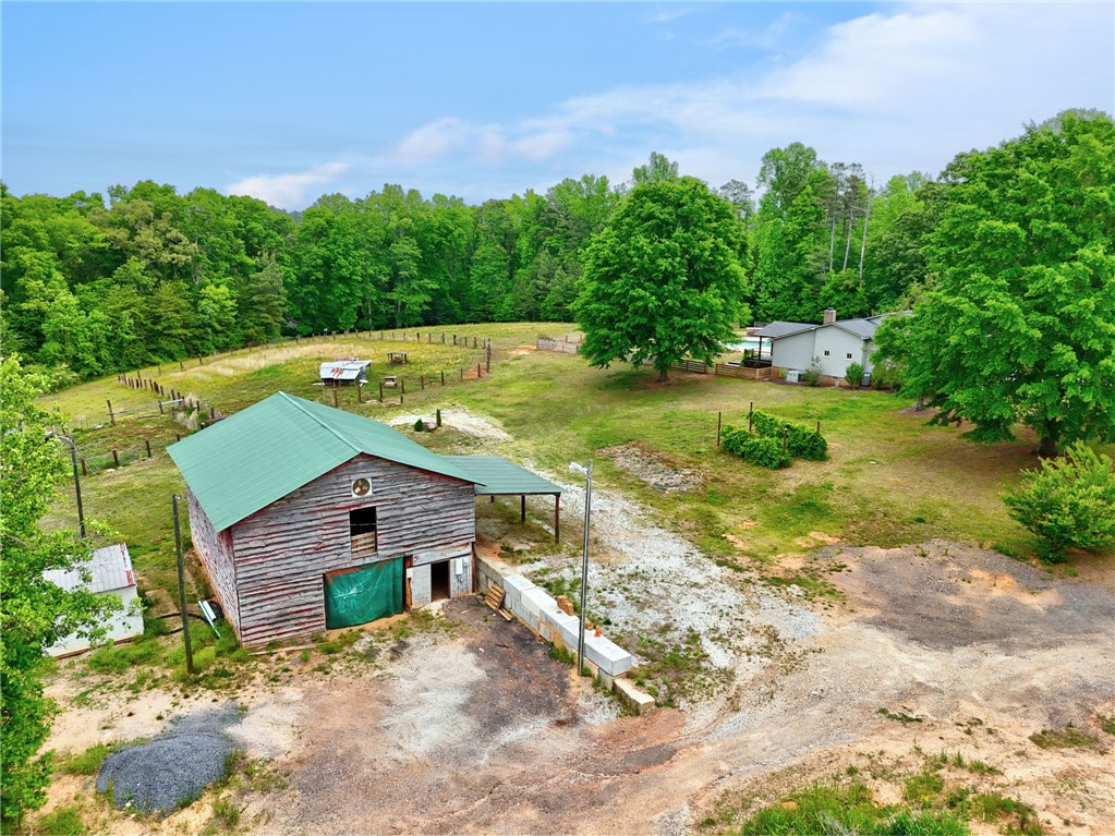 433 Latham Road Easley, SC 29640 - Photo 31 of 50 A rural retreat with a charming barn and verdant grounds, surrounded by mature trees.