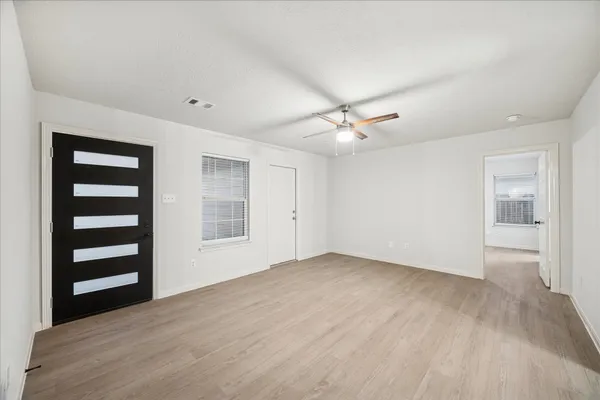 a view of an empty room with a window