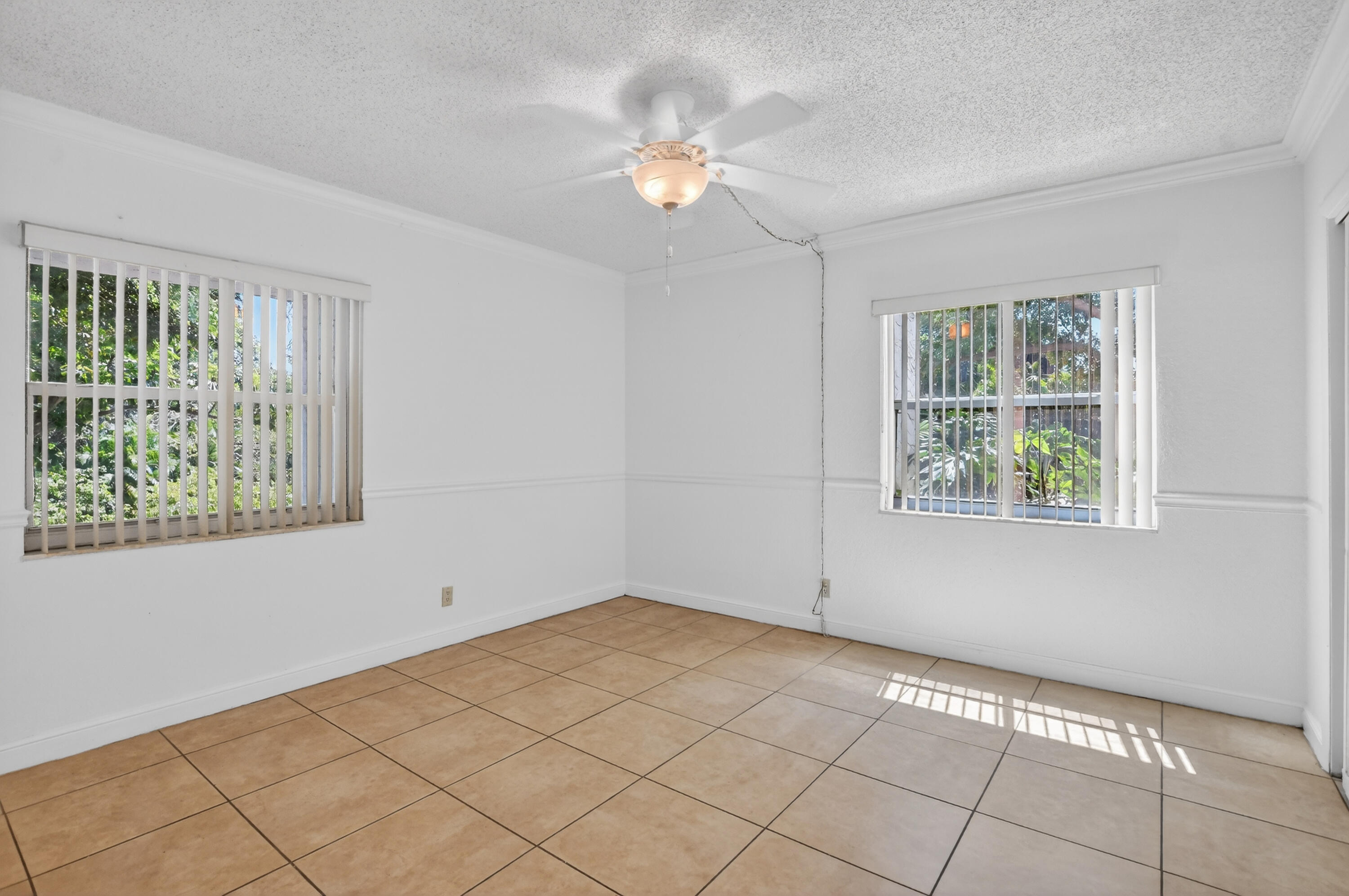 636 Northwest 13th Street, Unit 110 Boca Raton, FL 33486 - Photo 17 of 35 a view of an empty room with a window