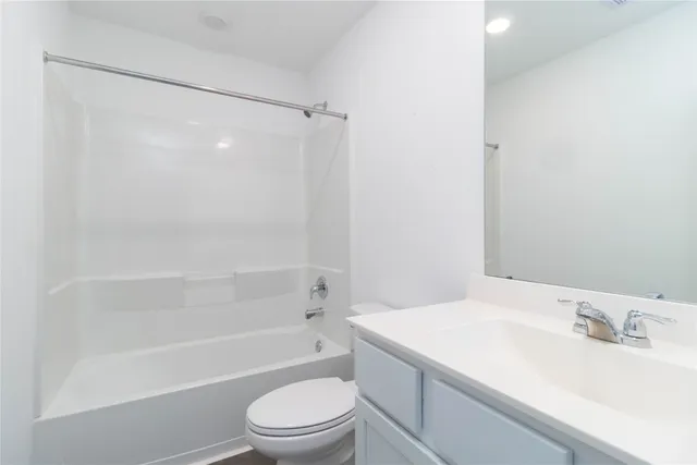 a bathroom with a sink a toilet and a bathtub