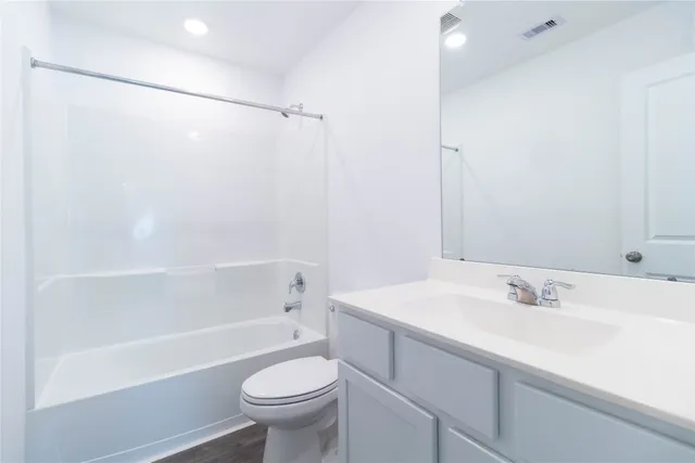 a bathroom with a sink a toilet and a bathtub