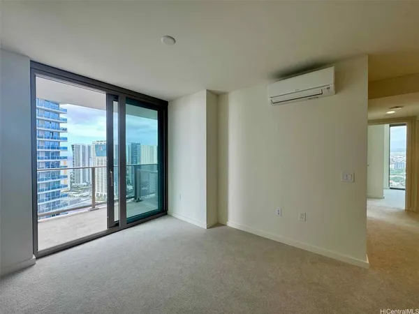 a view of an empty room with glass door