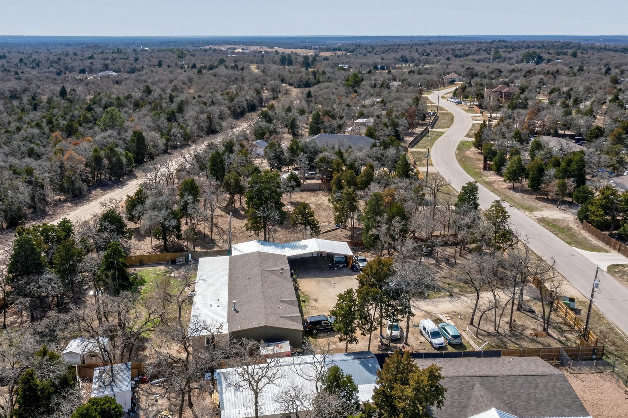 147 Jasmine Heights Elgin, TX 78621 - Photo 11 of 22 an aerial view of a house with a yard