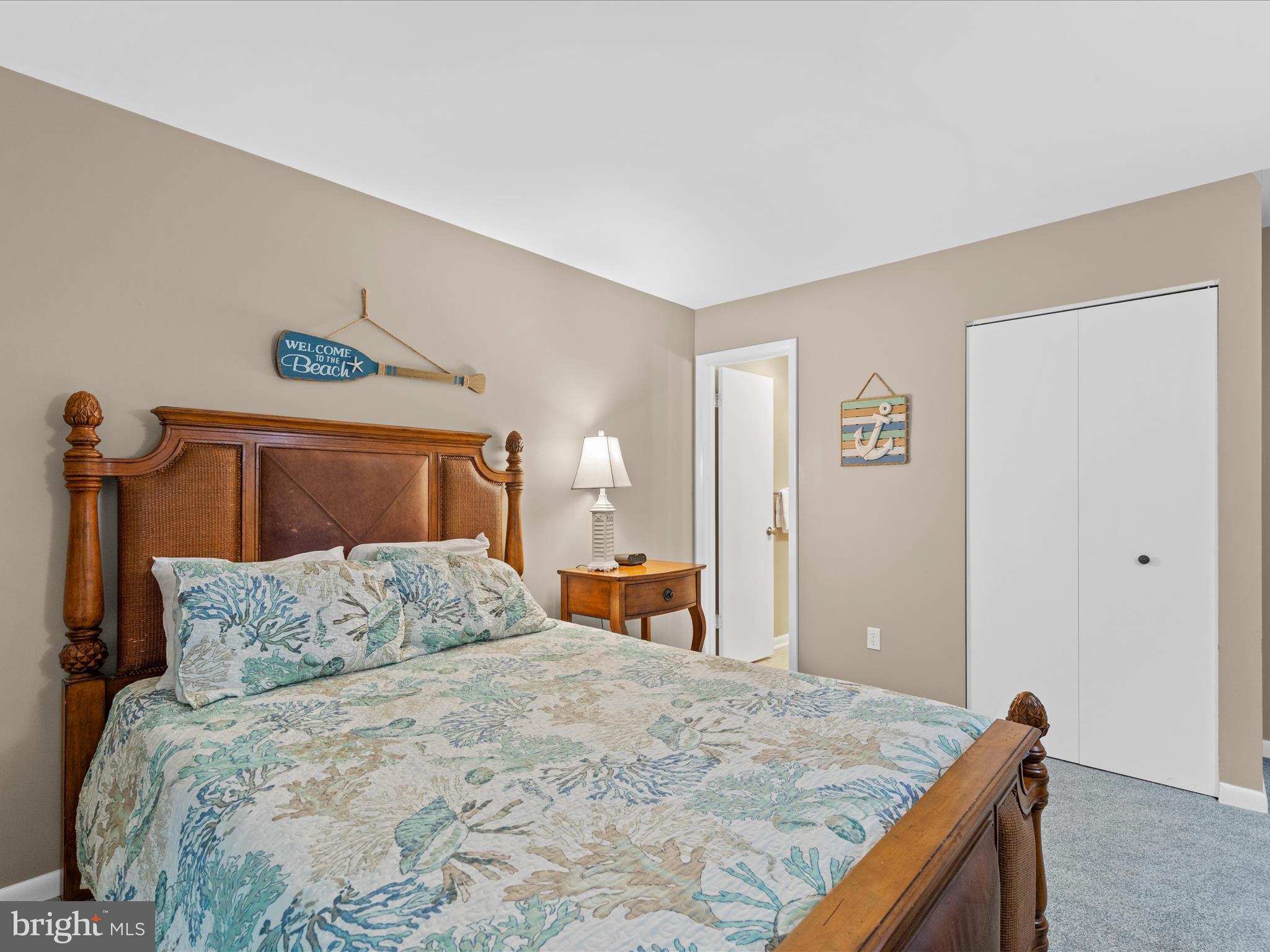 39346 Racquet Lane, Unit 8504 Bethany Beach, DE 19930 - Photo 26 of 40 a bedroom with a bed and a dresser