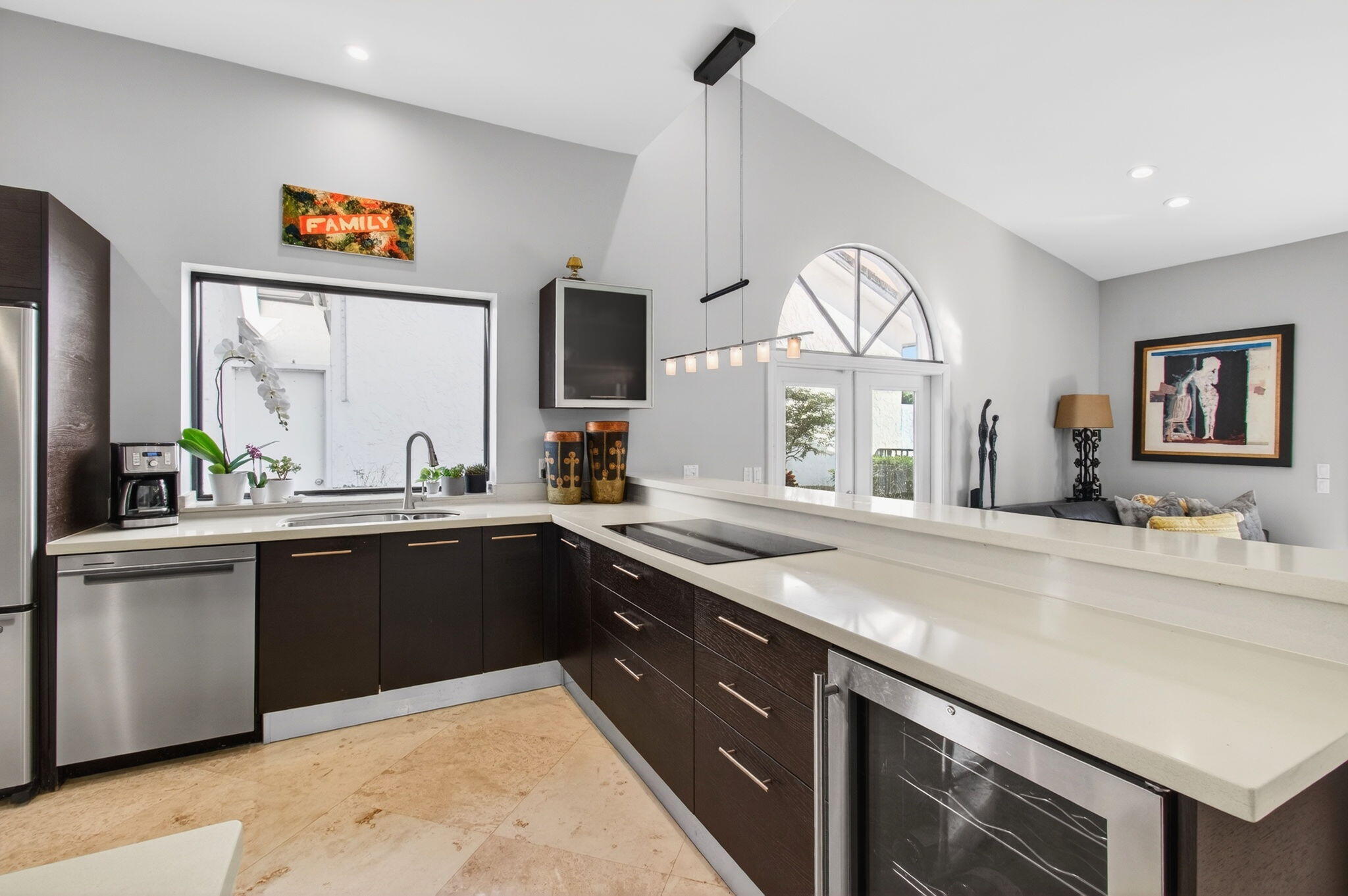 23145 Via Stel Boca Raton, FL 33433 - Photo 16 of 72 a kitchen with stainless steel appliances granite countertop a sink a stove and a wooden floors