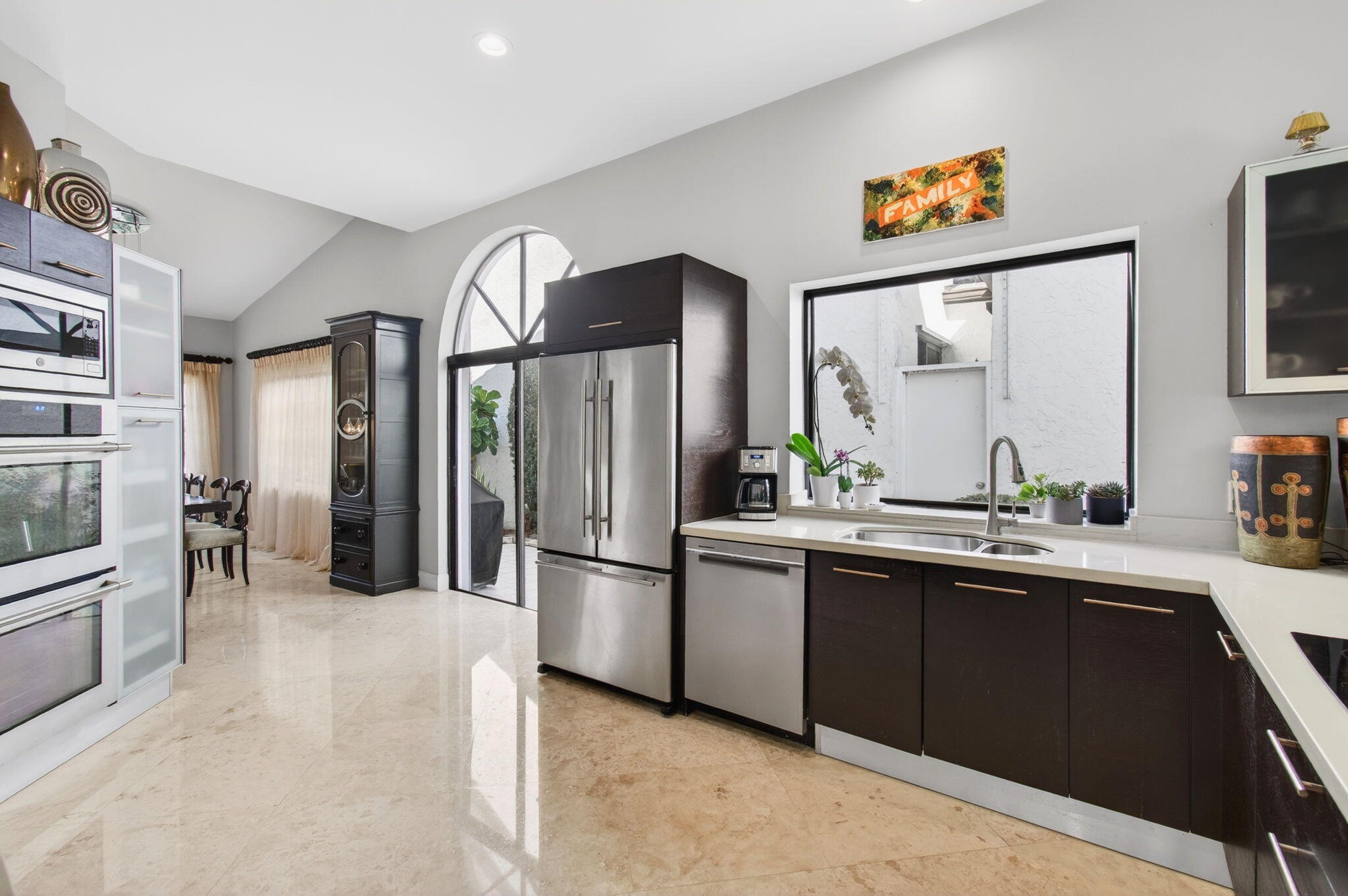 23145 Via Stel Boca Raton, FL 33433 - Photo 17 of 72 a kitchen with stainless steel appliances a refrigerator and a sink