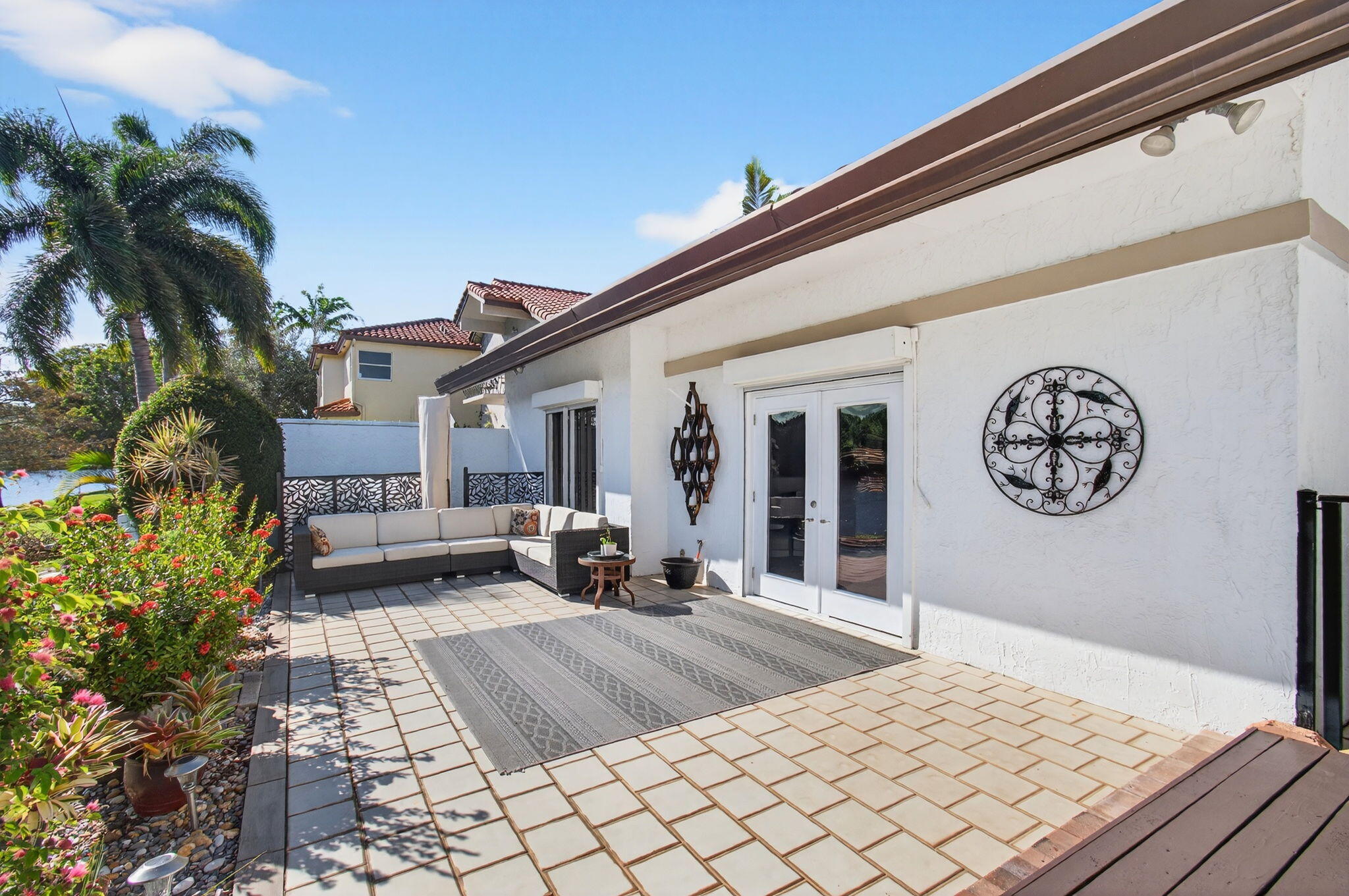 23145 Via Stel Boca Raton, FL 33433 - Photo 40 of 72 a view of a house with backyard porch and sitting area
