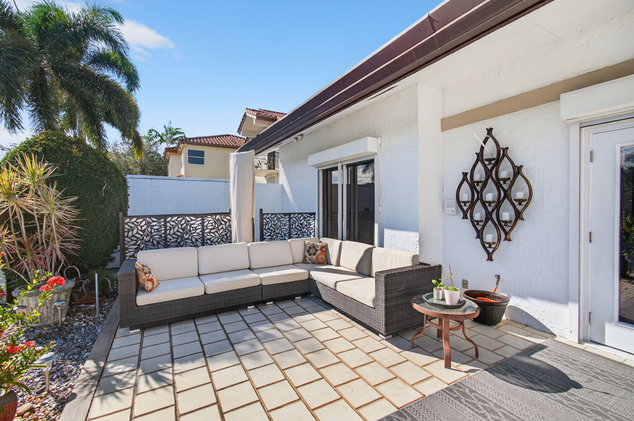 23145 Via Stel Boca Raton, FL 33433 - Photo 42 of 72 a building outdoor space with patio furniture and potted plants