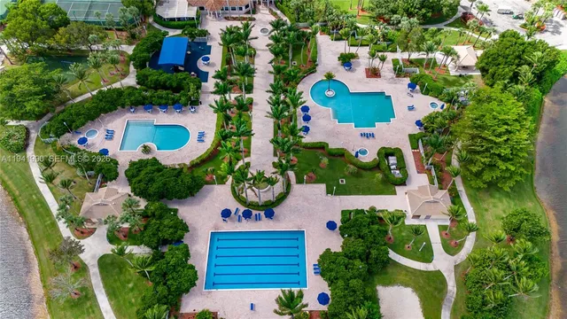 an aerial view of residential house with outdoor space and swimming pool