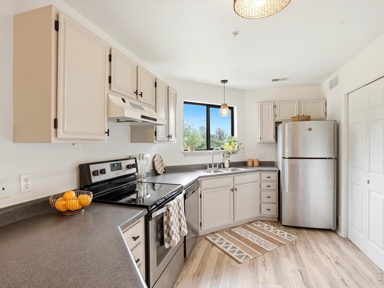 4945 Twin Lakes Road, Unit 46 Boulder, CO 80301 - Photo 17 of 42 The updated kitchen features freshly painted cabinetry, updated hardware, and newer appliances.
