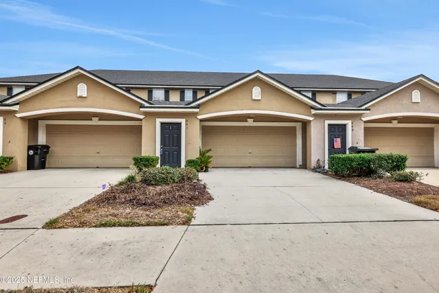 a front view of a house with yard