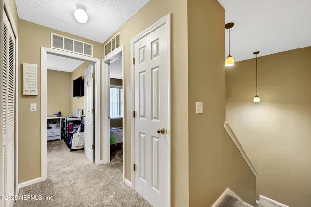 a view of hallway with walk in closet