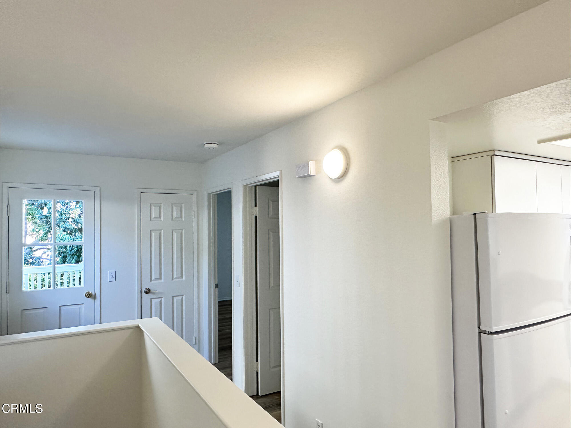 356 Highland Drive Oxnard, CA 93035 - Photo 13 of 26 a view of a kitchen with a refrigerator a microwave and a sink