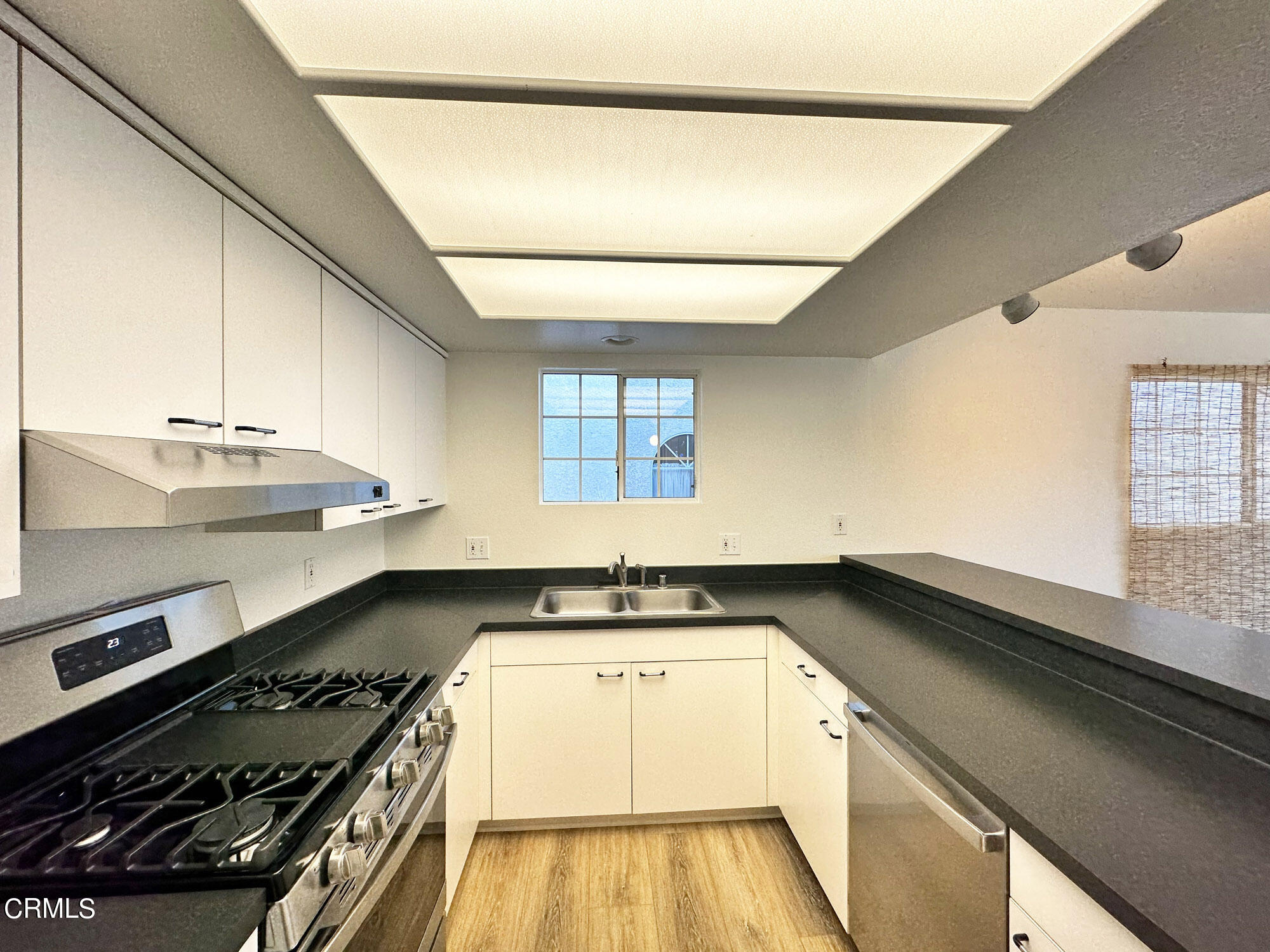 356 Highland Drive Oxnard, CA 93035 - Photo 8 of 26 a kitchen with granite countertop a stove and a sink