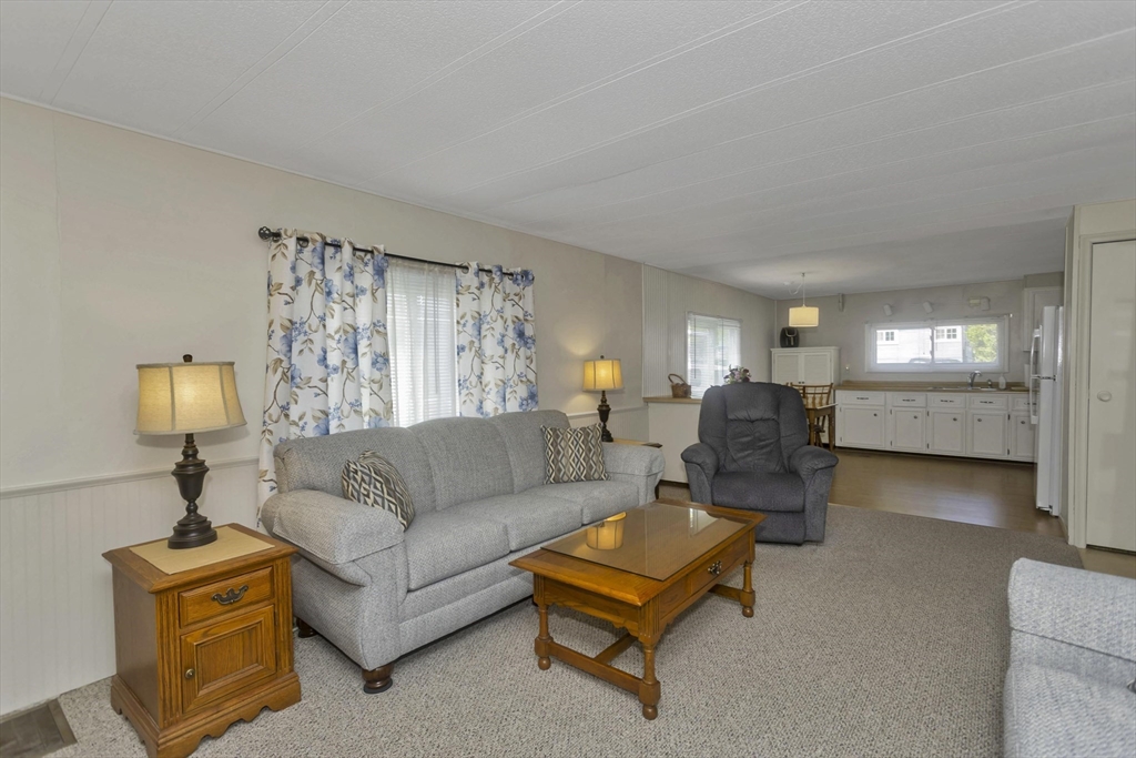 32 Puffin Drive Chicopee, MA 01020 - Photo 12 of 25 a living room with furniture and a table