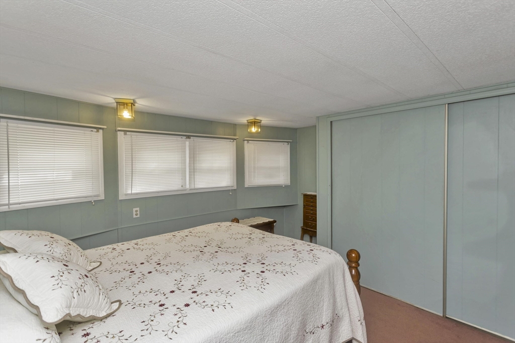 32 Puffin Drive Chicopee, MA 01020 - Photo 14 of 25 a bedroom with a bed and a window with dresser