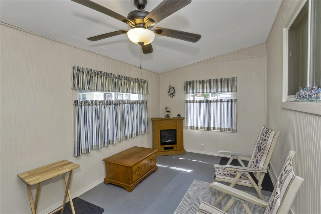 32 Puffin Drive Chicopee, MA 01020 - Photo 20 of 25 a living room with furniture a fireplace and a window