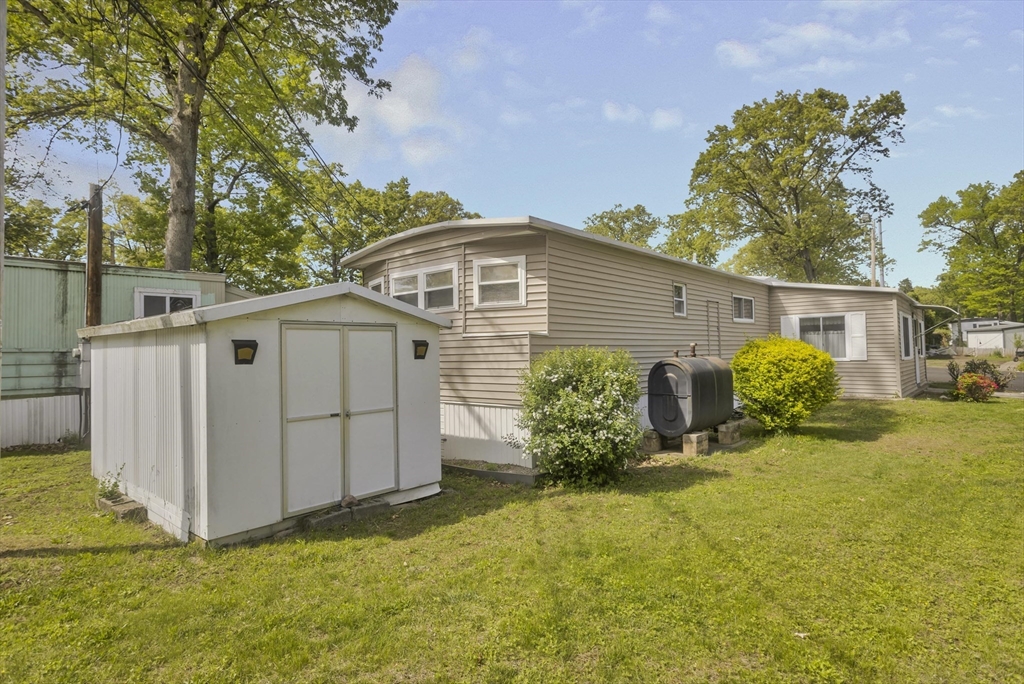 32 Puffin Drive Chicopee, MA 01020 - Photo 23 of 25 a view of a house with backyard and garden