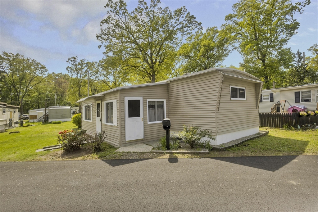 32 Puffin Drive Chicopee, MA 01020 - Photo 25 of 25 a view of a house with backyard and a tree