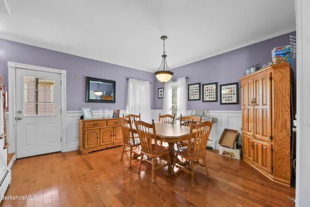 a view of a dining room with furniture window and wooden floor