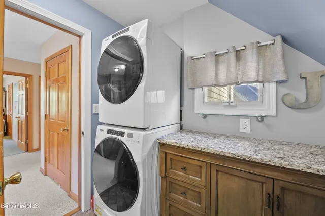 a utility room with a sink a washer and dryer