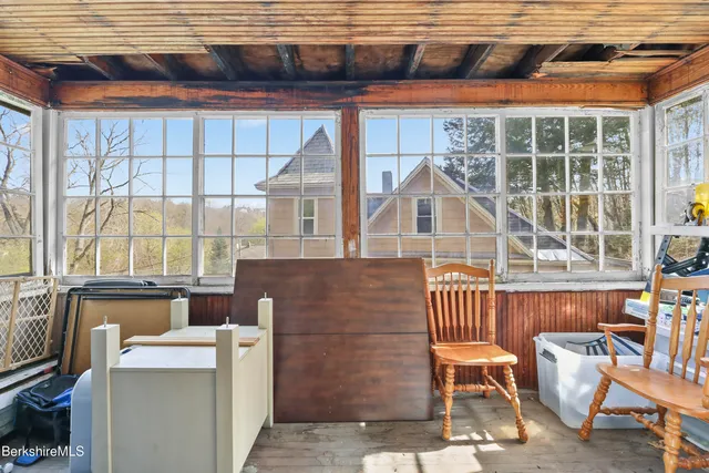 a view of a chair and table in the balcony