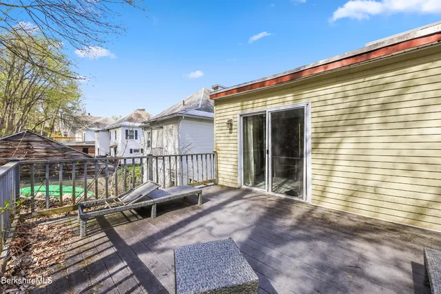 a view of a balcony with furniture