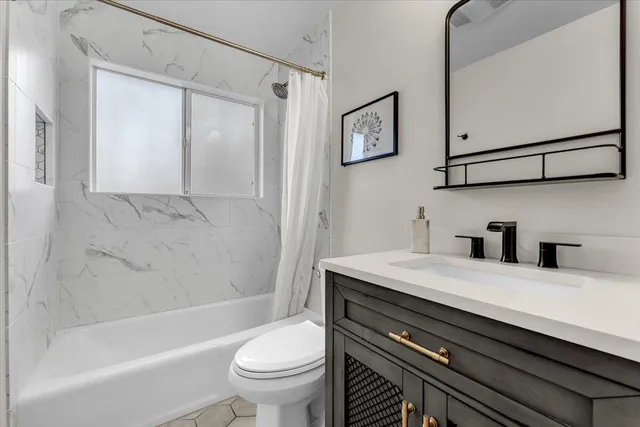 a bedroom with a bed and a chair