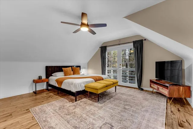 a bedroom with a bed and a couch