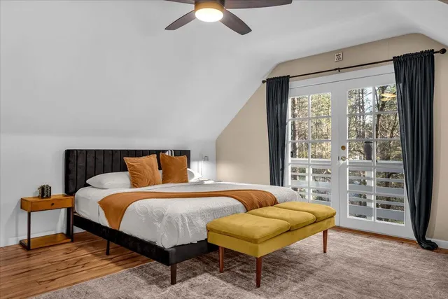 a view of balcony with wooden floor and seating