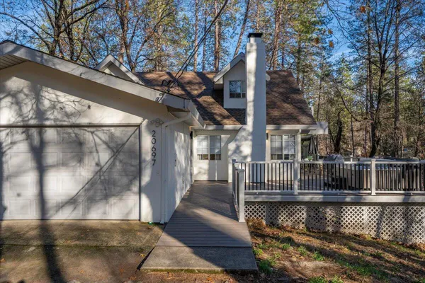 a view of balcony with two couches and wooden floor