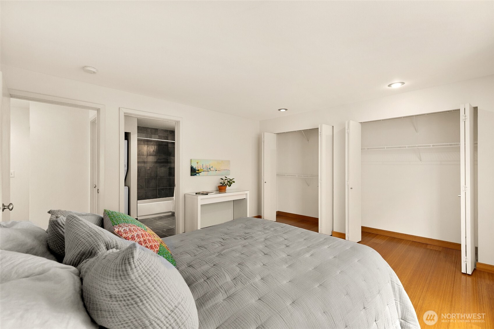 500 Aloha Street, Unit 202 Seattle, WA 98109 - Photo 11 of 15 a bedroom with a bed and wooden floor